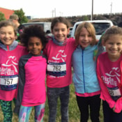 Girls on the Run participants smiling at 5k